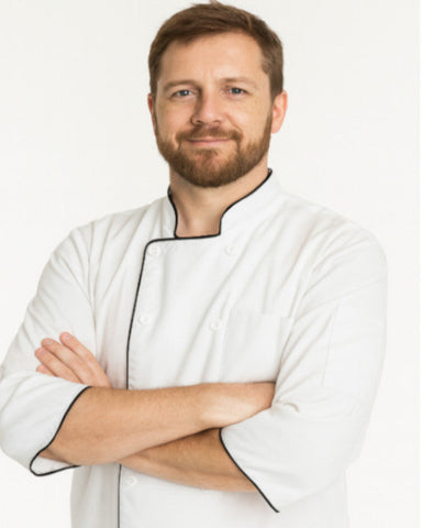 Man wearing a white chef's coat with black trim, Men's 3/4 sleeve chef coats, men's quarter sleeves chef coat, men's classic 3/4 sleeve chef coat