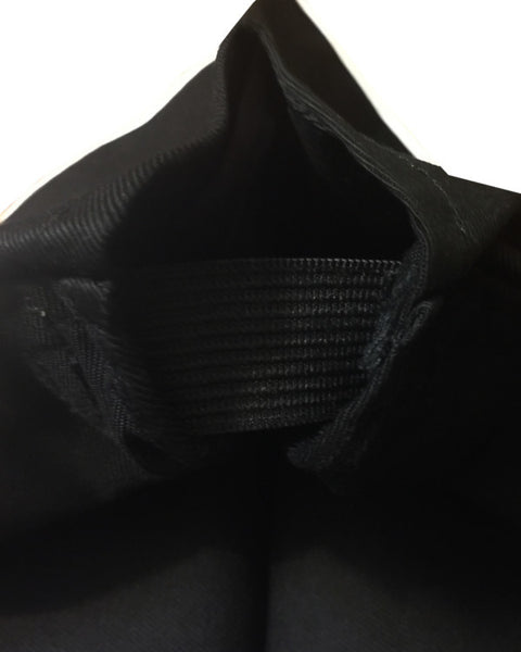 Inside view of the Black Chef Garrison Hat showing adjustable elastic for a customized fit.