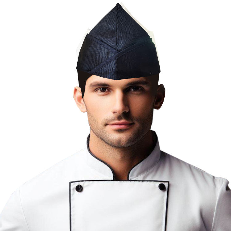 Black Chef Garrison Hat worn by a male chef, featuring a durable design and adjustable fit for kitchen professionals.